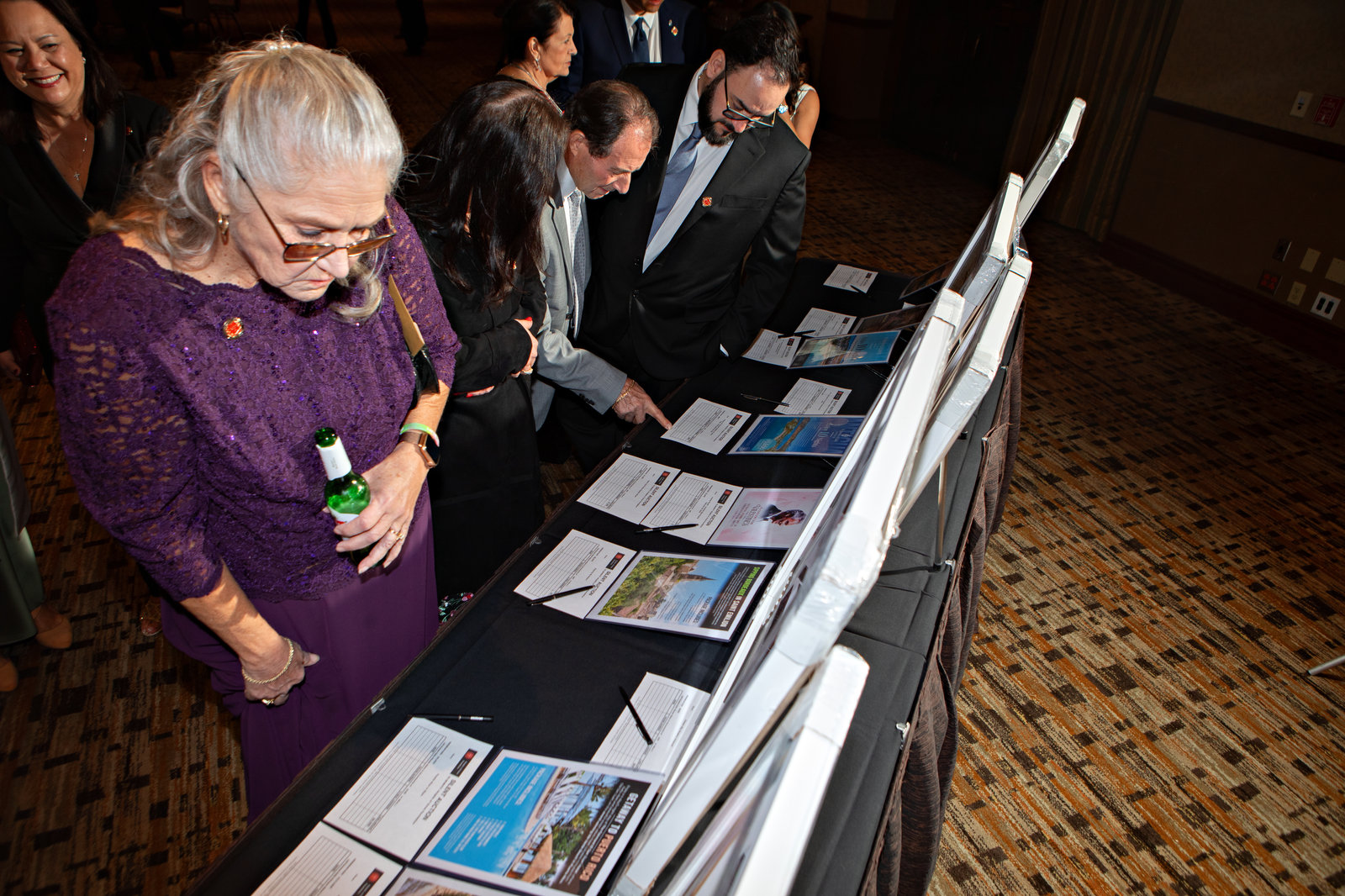Guests reviewing items during the Templar Gala silent auction