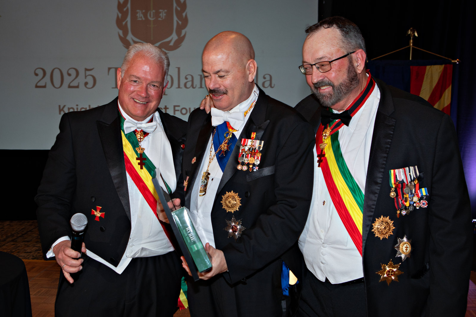 Members of the foundation presenting an honor on stage at the 2025 Templar Gala