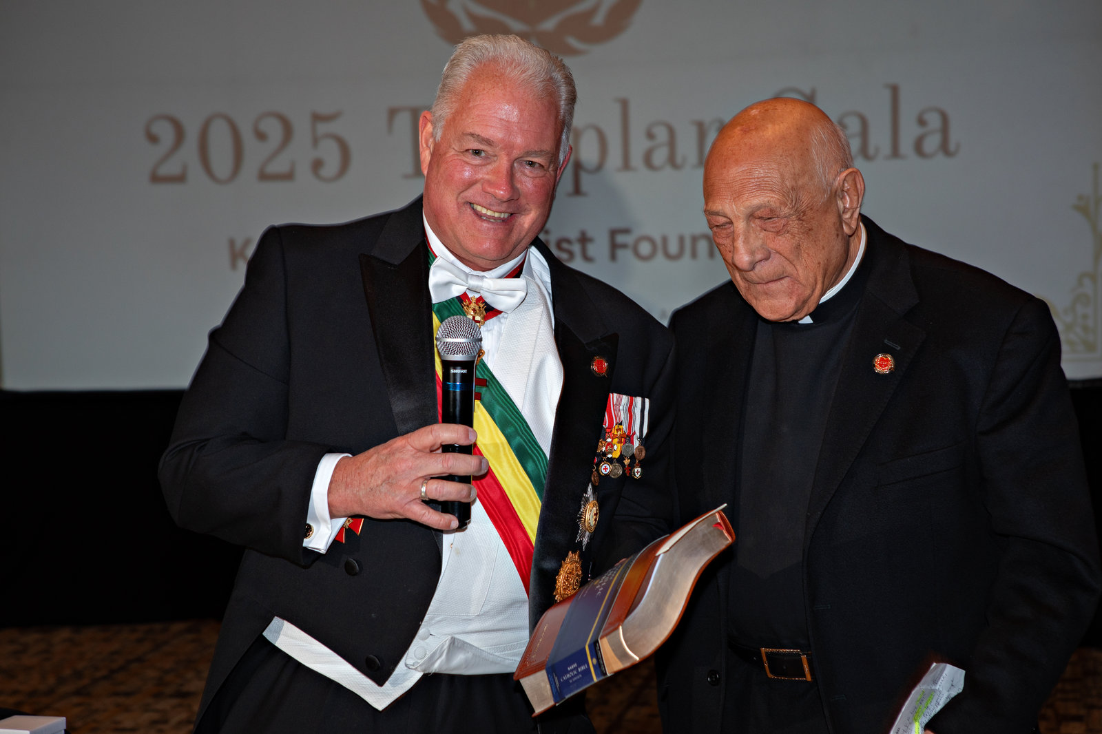A member speaking with a guest during the 2025 Templar Gala program
