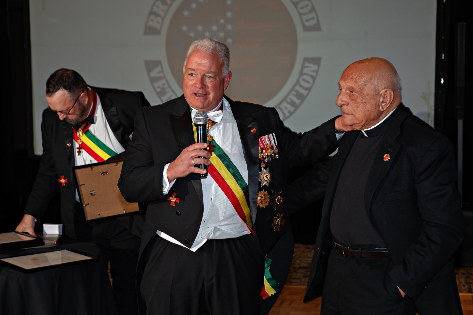 Foundation members sharing remarks at the microphone during the gala