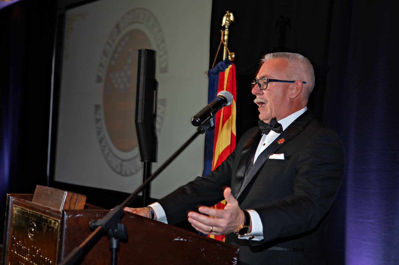 A member speaking at the podium during the Templar Gala presentations